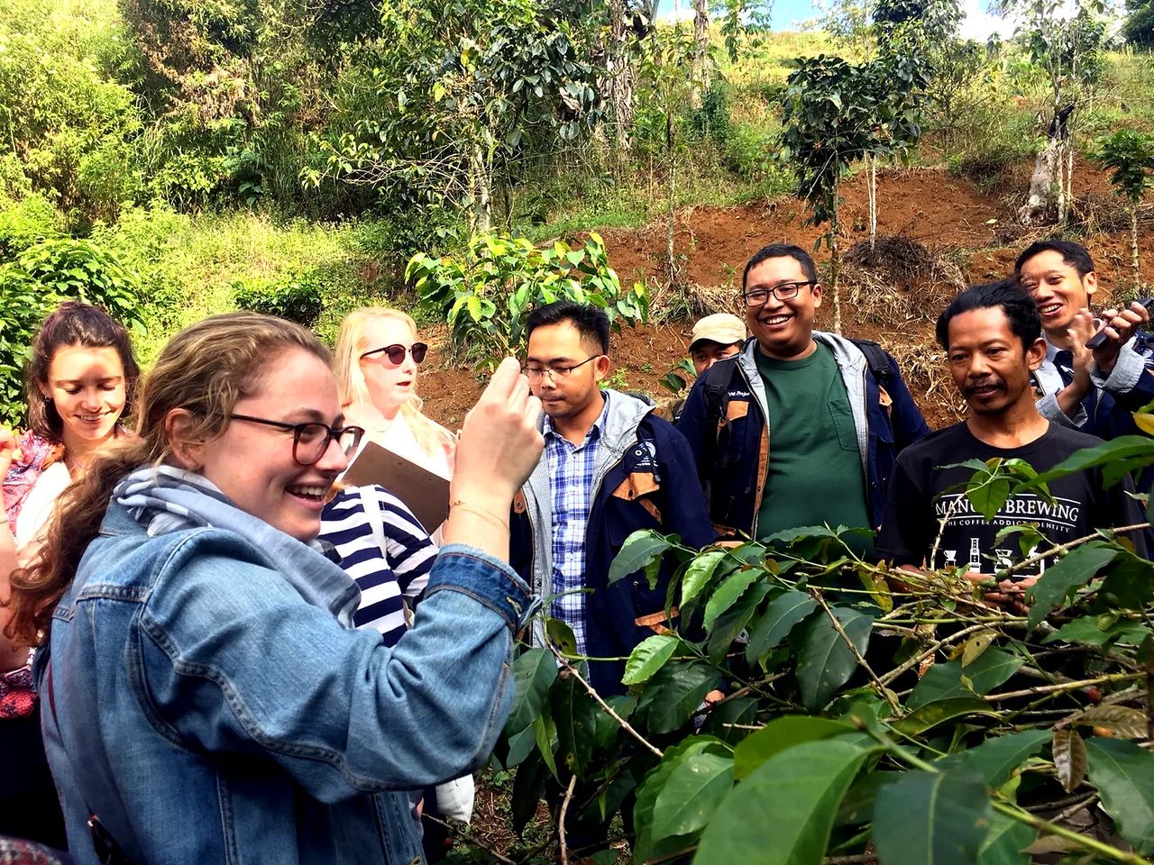 International and Indonesian students learning together at a coffee plantation during an EastXperience field-based educational program